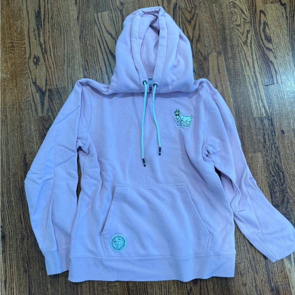 Light Pink Hoodie . Brand is GOAT . Size adult xs.